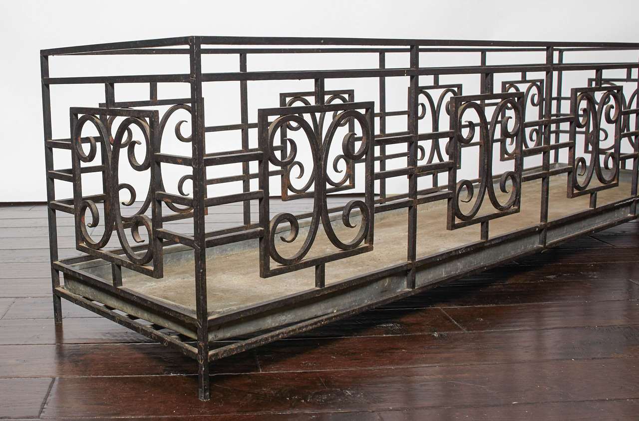 Painted black iron planter with removable liner. Measures: Liner's depth is 1.75 inches.
